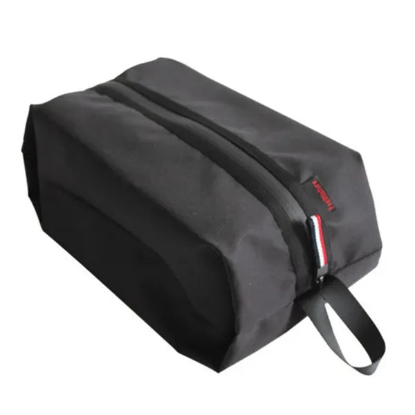 Black toiletry bag with a visible brand logo on a white background