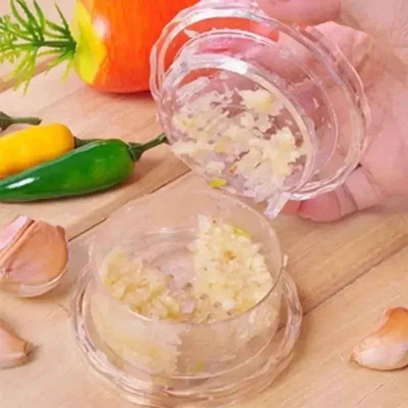 Manual twist garlic crusher – in blue or transparent