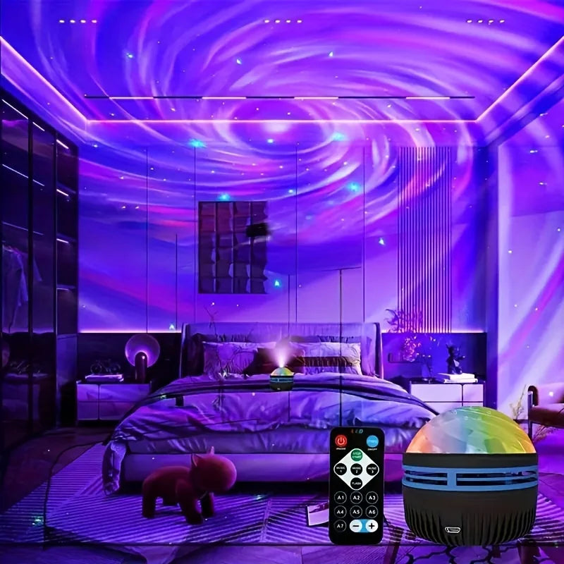 A bedroom scene illuminated by a purple and blue swirling galaxy projector light, with a small remote control and a round multicolor projector lamp shown in the foreground. The room features mirrored walls and ceiling, and the projector casts a vivid cosmic pattern across the space.